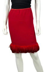 A red knee-length skirt with a feathered hem, displayed on a white mannequin against a plain white background.