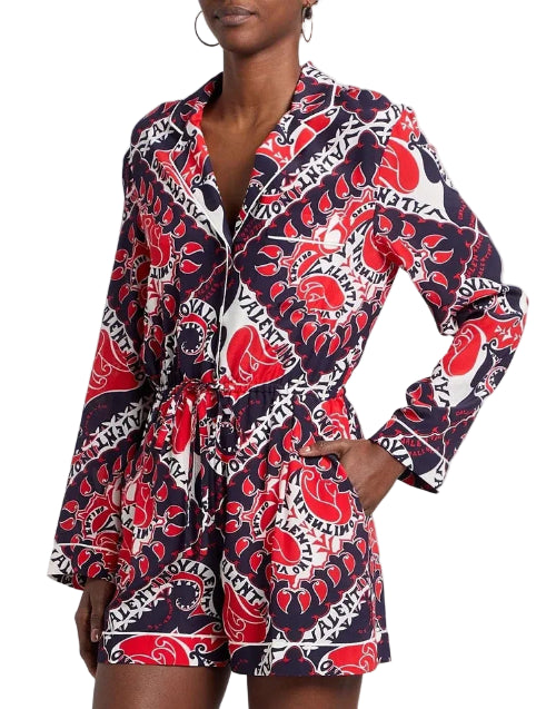 Woman wearing a colorful patterned dress with a blurred background