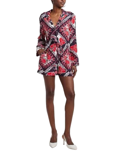 Person wearing a patterned outfit on a plain background