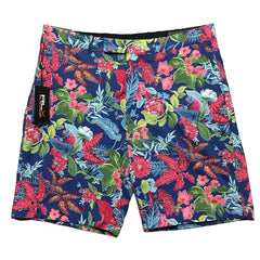Colorful floral-patterned shorts with a brand label on a plain background