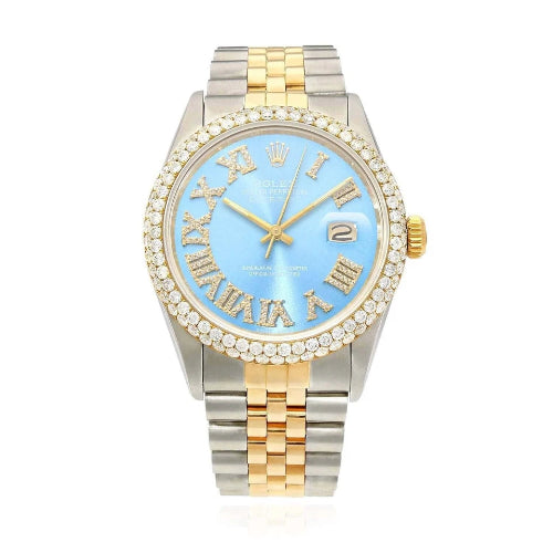 Two-tone watch with a blue face and gold accents on a white background