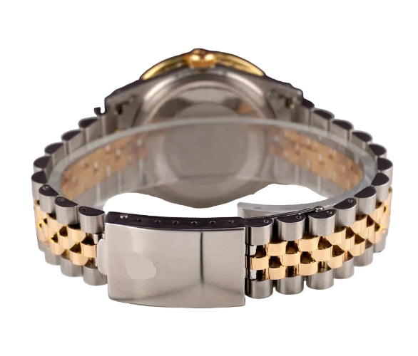 Two-tone watch with gold and silver band on a white surface