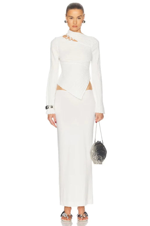 Woman wearing a white dress with a plain background