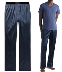 A side-by-side comparison of a pair of men's dark blue pants shown on a mannequin (left) and worn by a model (right). The pants feature a relaxed, straight-leg fit with a drawstring waistband.