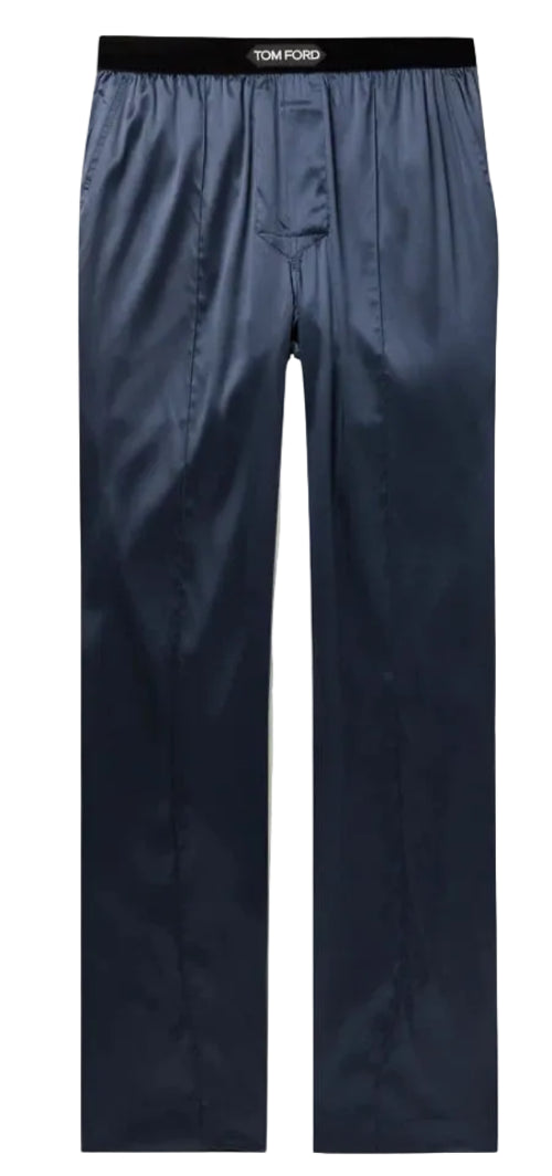 Tom Ford navy blue satin trousers with a black elastic waistband featuring the white TOM FORD logo, shown flat on a light background.