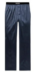 Tom Ford navy blue satin trousers with a black elastic waistband featuring the white TOM FORD logo, shown flat on a light background.