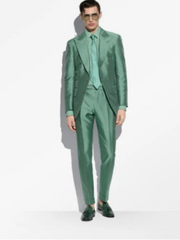 Man wearing a green suit on a white background