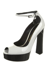 White high-heeled shoe with a black sole on a white background