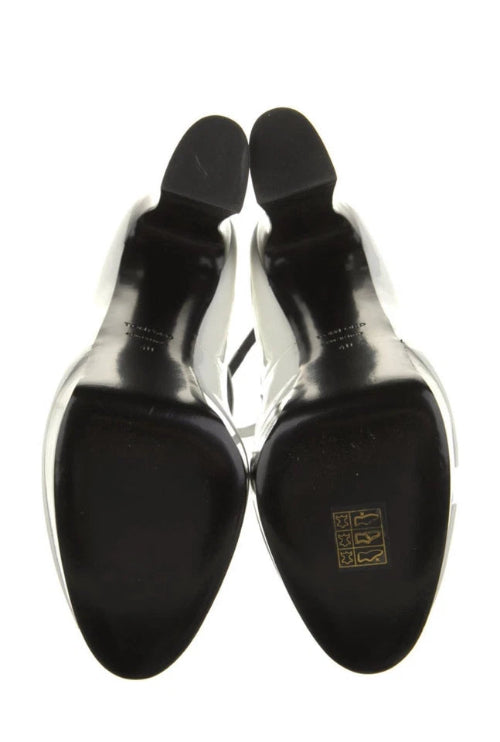 Black dress shoes with a visible brand logo on a white background
