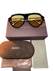 Tom Ford sunglasses with case and box on a wooden surface