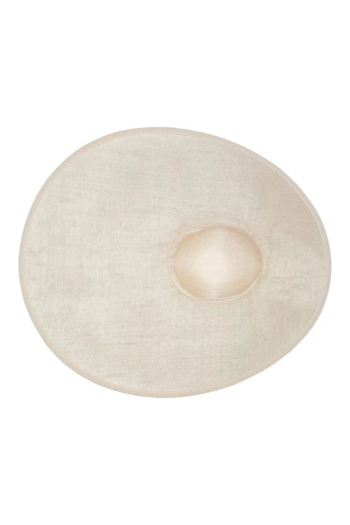 An off-white textured fabric breast pad with a central dome-shaped opening, shown on a solid white background.