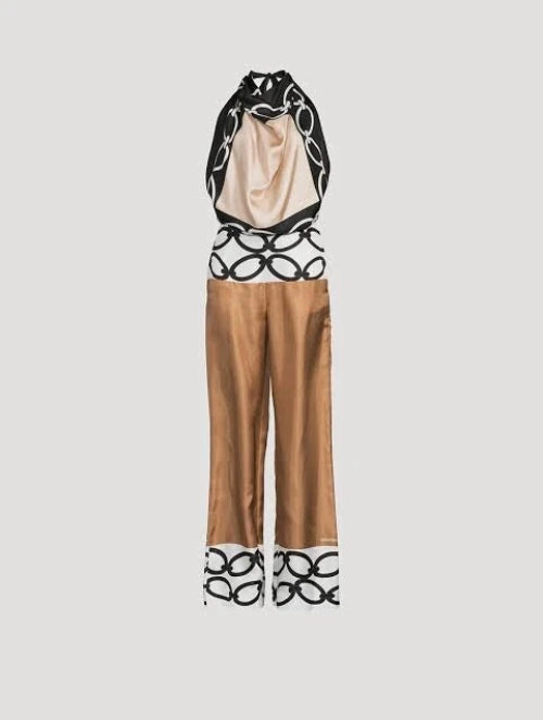 Fashion outfit with a top and pants featuring black and white pattern on a light gray background