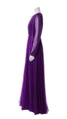 Purple evening gown on a mannequin against a white background