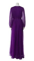 Purple evening gown on a mannequin against a white background