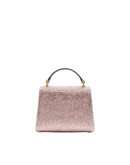 Pink textured handbag on a white background