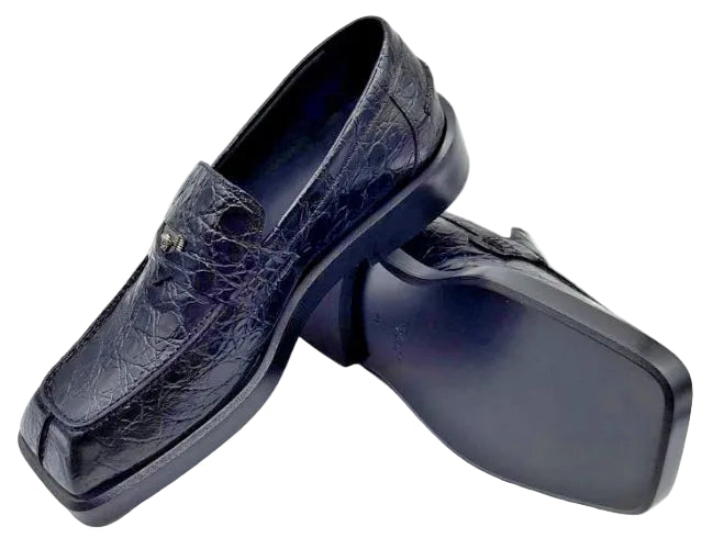 Pair of dark blue leather loafers on a white background
