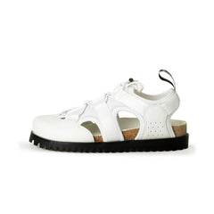 White sandal with a black sole on a white background
