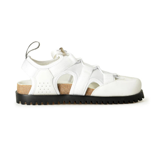 White sandal with black sole on a white background