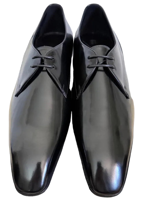 Black dress shoes on a plain background