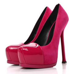 A pair of bright fuchsia pink high-heeled pumps with glossy patent leather uppers and platform soles, shown against a plain white background.