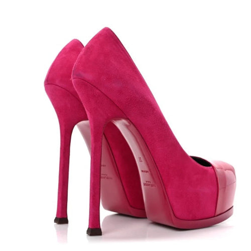 A pair of bright pink suede-like high-heeled pumps with stiletto heels and open toes, shown on a plain white background.